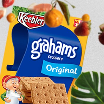 Keebler Original Grahams Crackers surrounded by fruits and leaves