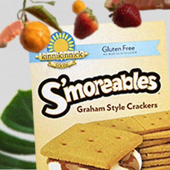 Kinnikinnick S'moreables Graham Style Crackers surrounded by fruits and leaves